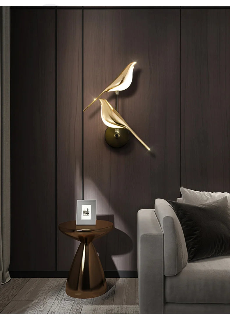 Luminous Lumens: The Modern Bird Sconce with Golden Glow