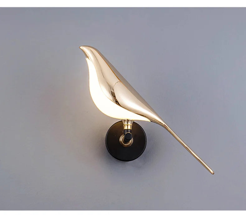 Luminous Lumens: The Modern Bird Sconce with Golden Glow